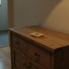 freepik__closeup-of-a-rustic-wooden-shoe-cabinet-in-a-cozy-__7982
